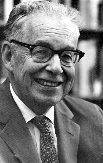Black-and-white portrait photograph of seismologist Charles F. Richter, inventor of the Richter magnitude scale, in his Caltech office.