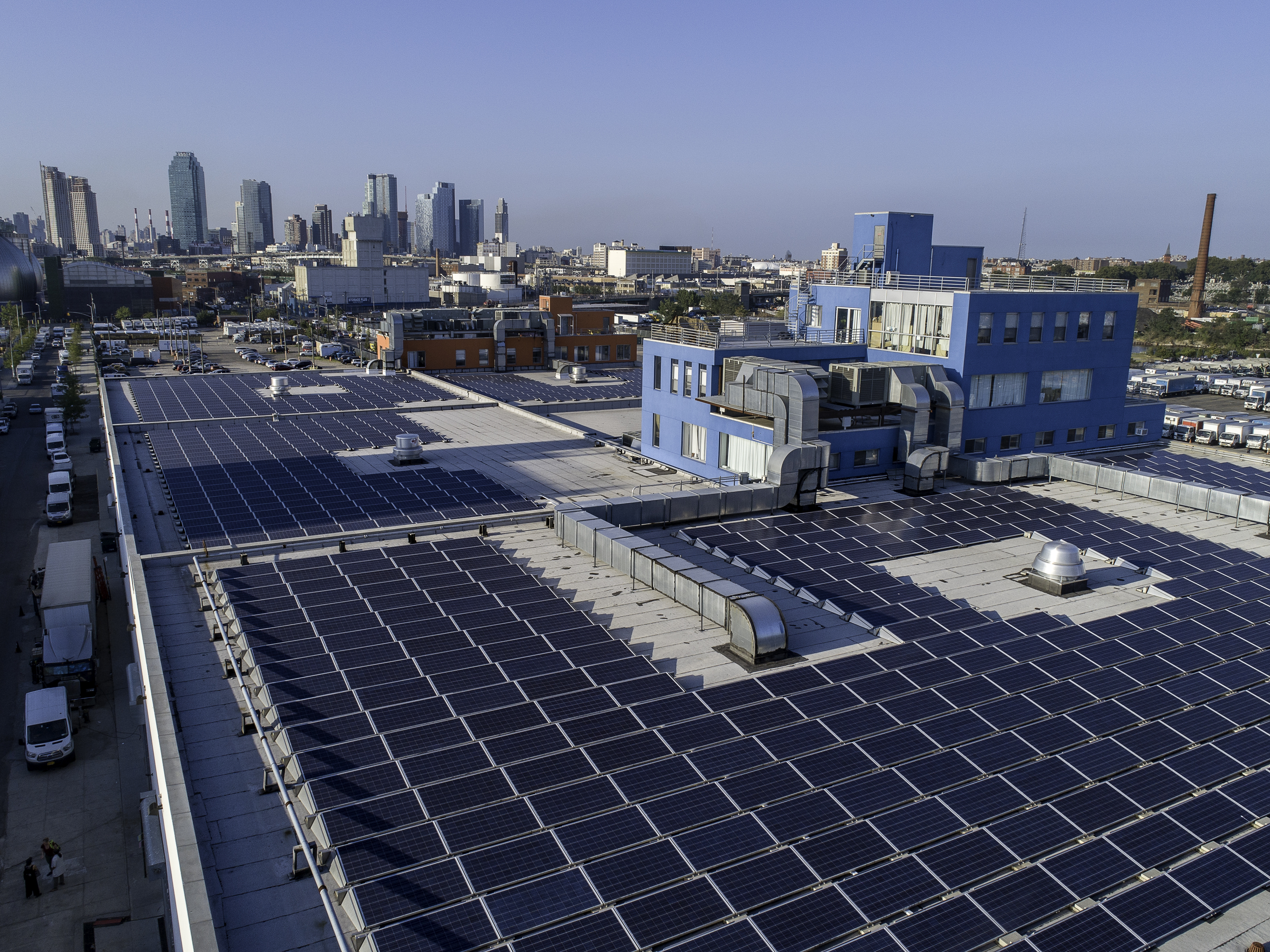 Aerial drone photograph of rooftop solar panels covering a Brooklyn industrial building, 520 Kingsland Avenue.
